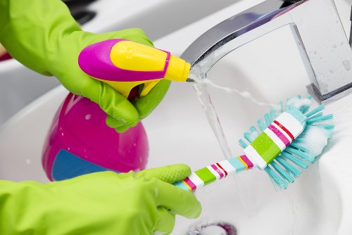 Cleaning supplies arranged for domestic cleaning in Hampstead home