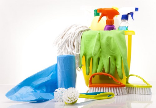 Cleaner checking the work area for hazards before continuing